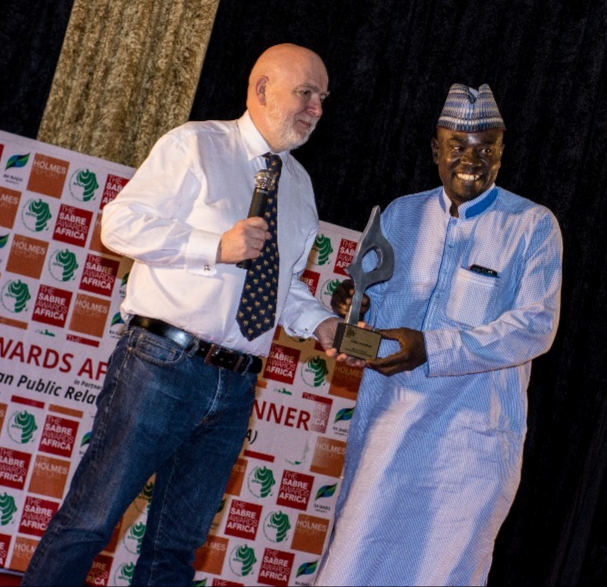 Chair Panel of Judges, Paul Holmes presents SABRE African Public Relations Awards to Yushau Shuaib of PRNigeria in Gaborone Botswana