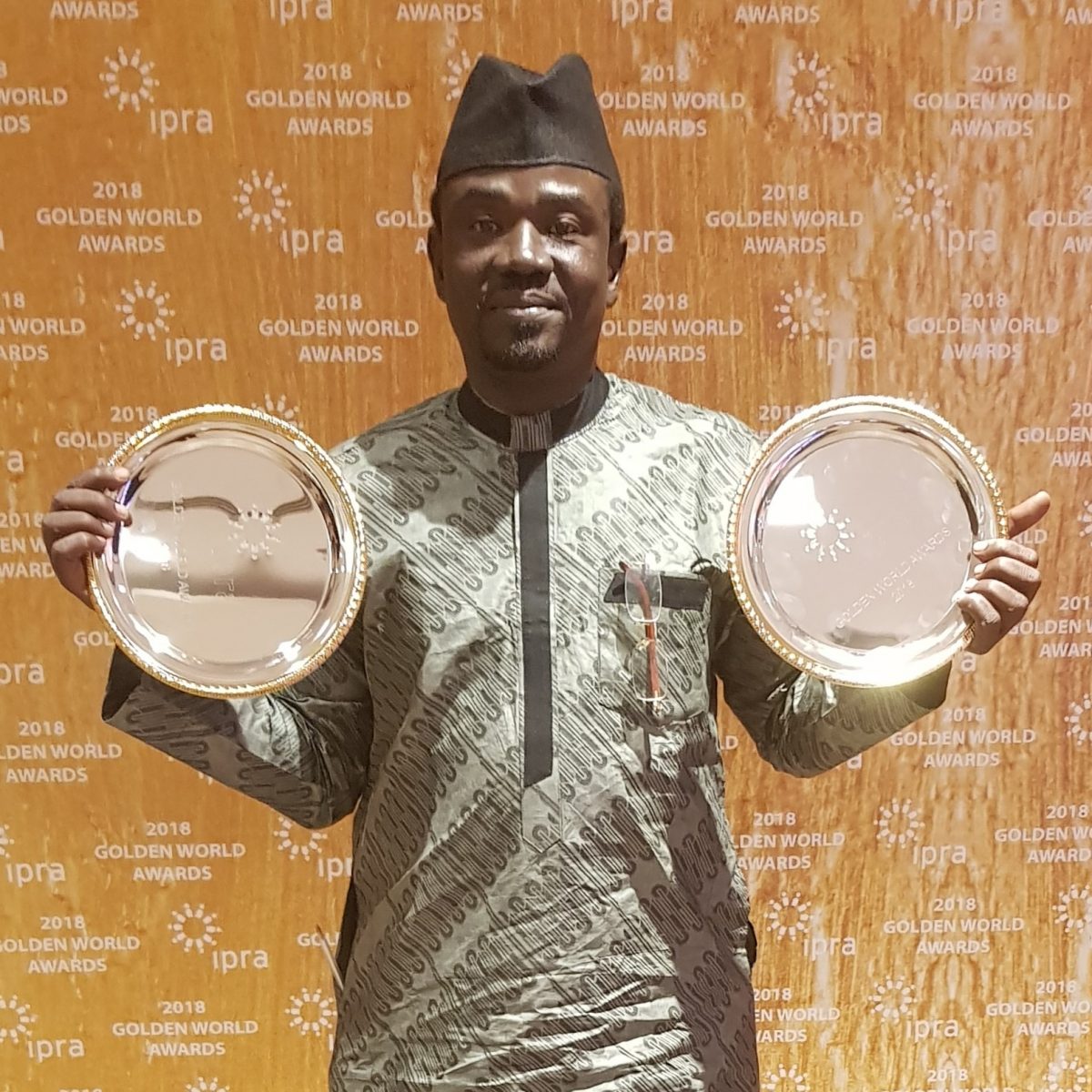 Yushau Shuaib, author and PR practitioner displays two Golden World Awards from IPRA in Barcelona, Spain