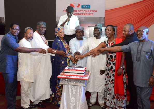 Guests at FCT NIPR AGM/ Conference and Award Night Cut the Cake