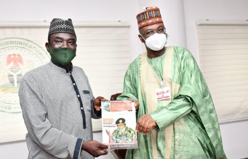 Editor-in-Chief Yushau A. Shuaib presents a copy of Economic Confidential to Minister of Communication and Digital Economy Dr Isa Pantami