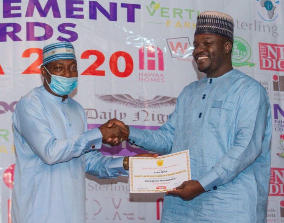 Air Comdr Yusuf Anas of CCC presents SAEMA award to Dr. Mohammed Goje of YOSEMA