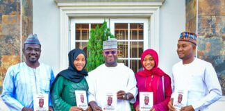 IMPR Staff Presents Book To Gov Yahaya Bello