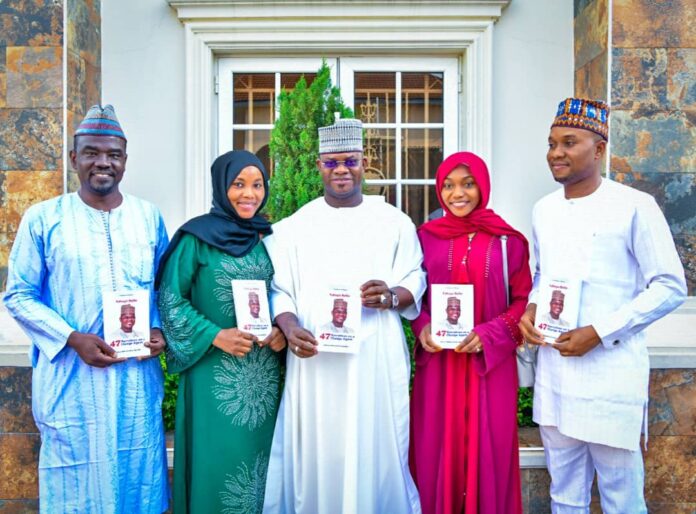IMPR Staff Presents Book To Gov Yahaya Bello