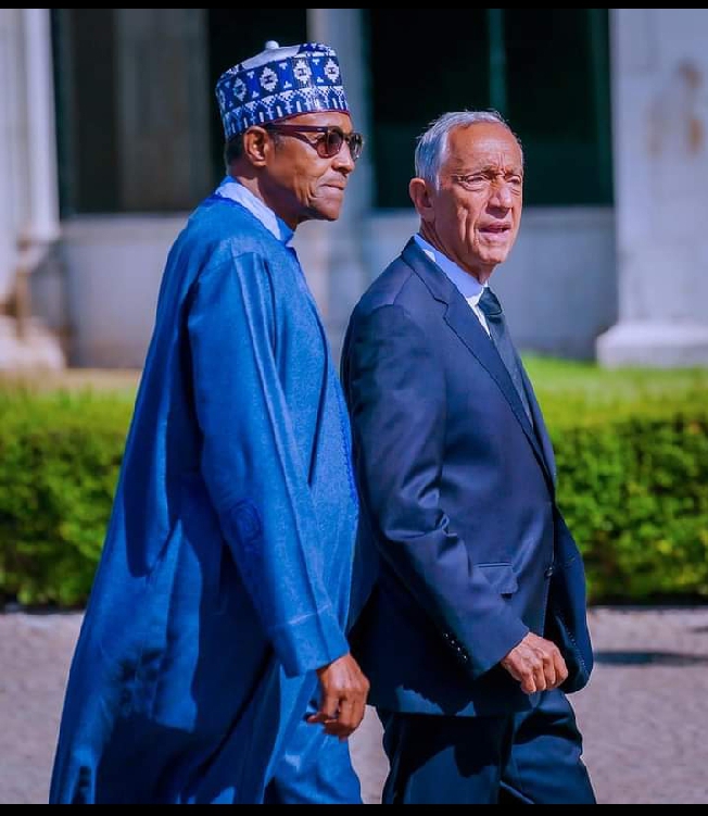 President Muhammadu Buhari walking with his Portuguese counterpart, President Marcelo Rebelo de Sousa, as part of his state visit to Portugal.