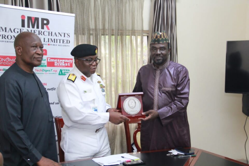 Major General Chris Olukolade (rtd), Commodore Adedotun Ayo-Vaughan presenting an award of excellent to Alh. Yushau Shuaib Publisher of PRNigeria and Economic Confidential