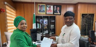 Hajia Sa'adatu Belgore Receiving Her Appointment Letter From Hon. Goddy Jedy-Agba