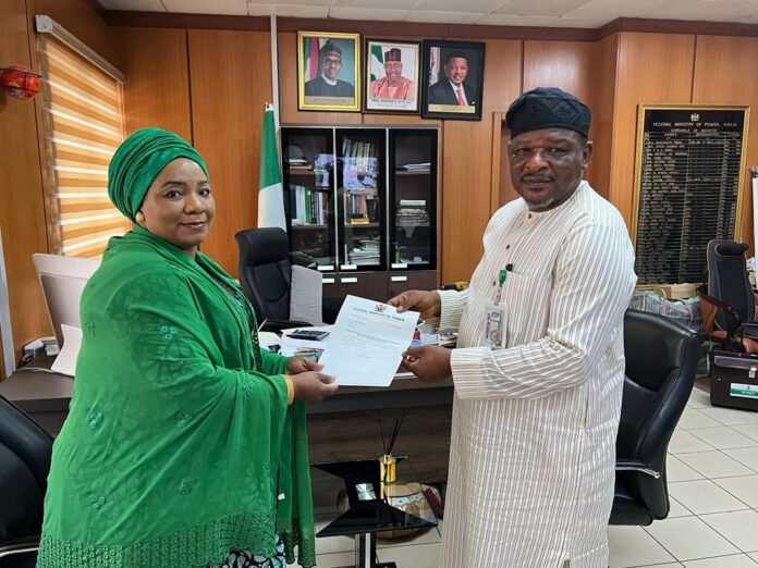 Hajia Sa'adatu Belgore Receiving Her Appointment Letter From Hon. Goddy Jedy-Agba