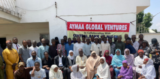 A cross-section of eNaira sensitisation agents in a group photograph after a briefing by the Central Bank of Nigeria (CBN) and Aymaa teams in Malaali, Kaduna on Wednesday.