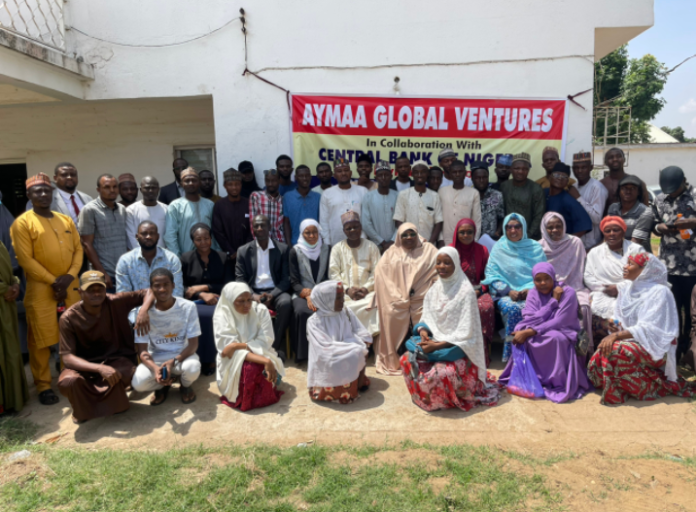 A cross-section of eNaira sensitisation agents in a group photograph after a briefing by the Central Bank of Nigeria (CBN) and Aymaa teams in Malaali, Kaduna on Wednesday.