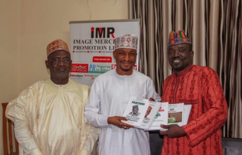 Malam Yushau Presenting Books to Alhaji Mannir Haidara