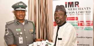 The Publisher of IMPR, Alhaji Yushau Shuaib Presenting Books to The Acting Comptroller-General of the Nigeria Customs Service (NCS), Mr Bashir Adewale Adeniyi