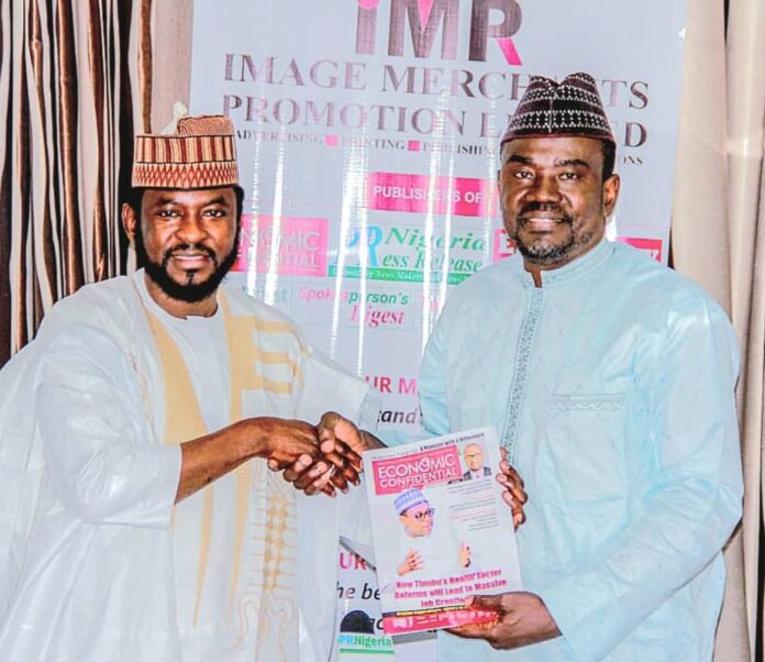 The CEO of IMPR, Alhaji Yushau Shuaib Presentating a Copy of Economic Confidential Magazine to The Executive Secretary of the National Commission for Almajiri and Out-of-School Children, Hon. Sha'aban Sharada