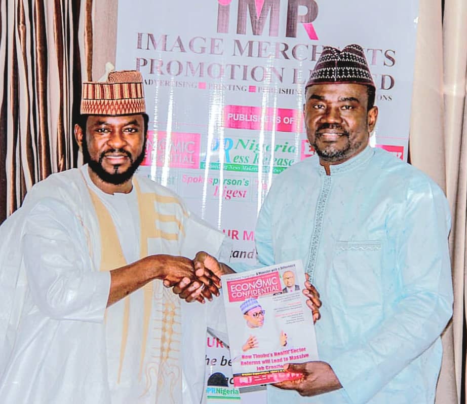 The CEO of IMPR, Alhaji Yushau Shuaib Presentating a Copy of Economic Confidential Magazine to The Executive Secretary of the National Commission for Almajiri and Out-of-School Children, Hon. Sha'aban Sharada