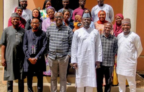 A Group Photo of Mr Muyiwa Fasakin and IMPR Staff