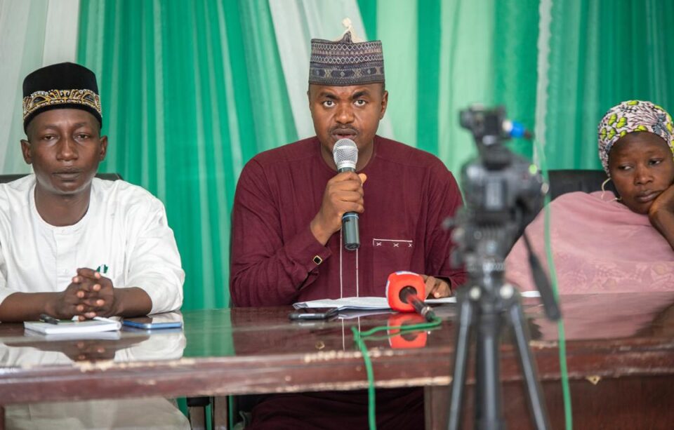Comrade Hamza Umar Saulawa (M) flagged by members of the coalition during the press briefing in Kano