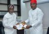 The Executive Secretary of the National Sugar Development Council (NSDC), Mr. Kamar Bakrin (L), receiving the president of the Abuja Chamber of Commerce and Industry (ACCI), Barrister Emeka Obegolu, SAN (R), who led a delegation to pay him a courtesy visit in his office.