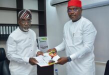 The Executive Secretary of the National Sugar Development Council (NSDC), Mr. Kamar Bakrin (L), receiving the president of the Abuja Chamber of Commerce and Industry (ACCI), Barrister Emeka Obegolu, SAN (R), who led a delegation to pay him a courtesy visit in his office.