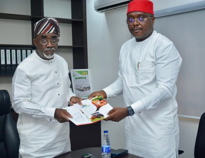 The Executive Secretary of the National Sugar Development Council (NSDC), Mr. Kamar Bakrin (L), receiving the president of the Abuja Chamber of Commerce and Industry (ACCI), Barrister Emeka Obegolu, SAN (R), who led a delegation to pay him a courtesy visit in his office.