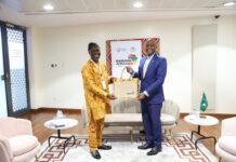 Picture: Olusegun Olutayo (Left), Senior Trade Expert/Lead, Trade Enablement, presenting a souvenir bag from the Nigeria AfCFTA Coordination Office to H.E. Wamkele Mene (Right), AfCFTA Secretary-General on the sidelines of Biashara Afrika 2024 on 11th October, 2024 in Kigali, Rwanda