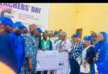 The Minister of State for Education, Dr Yusuf Tanko Sununu, COEASU Presenting Award to Best Student Mubarak Latona of FCE Iwo