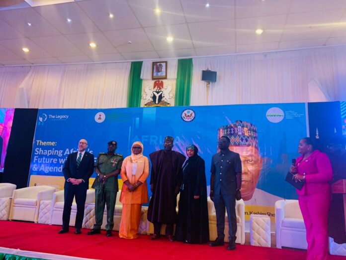 Representative of the Vice President, Kashim Shettima, Deputy Chief of Mission, Embassy of the United States of America, David Green, MWFAAN President and other delegates in a group photo