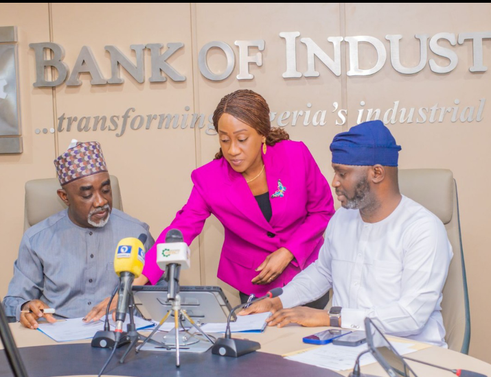 The Executive Secretary of the National Sugar Development Council (NSDC), Mr. Kamar Bakrin (L), with the Managing Director of the Bank of Industry (BOI), Dr. Olasupo Olusi (R), during the signing ceremony.