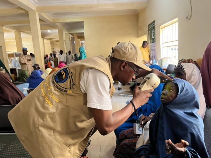 Medical personnel checking on a patient Medical personnel checking on a patient