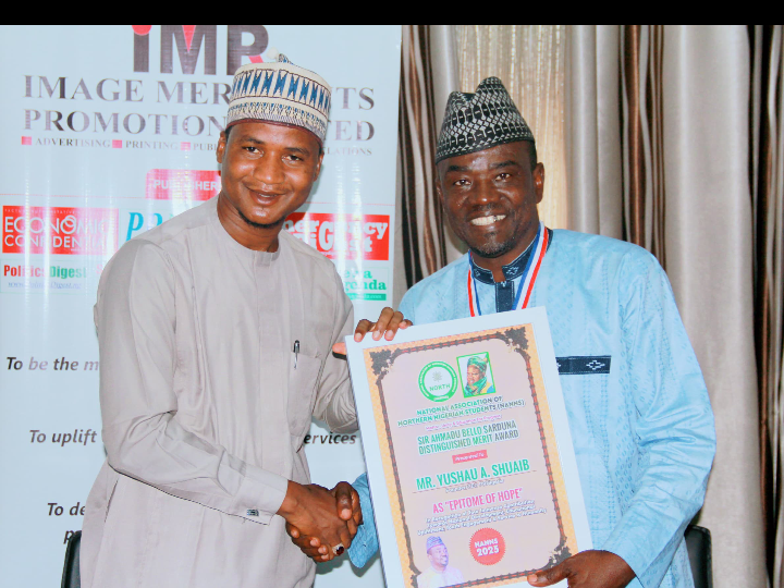 IMPR CEO Alh Yushau Shuaib receiving Sir Ahmadu Bello Sardauna Distinguished Merit Award honour from NANN's President, Abdulrahman Ibrahim